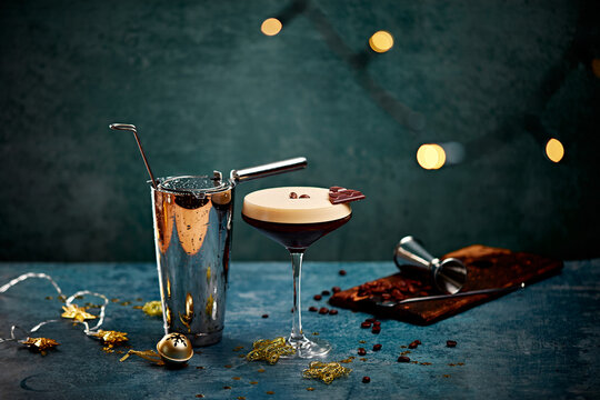 Espresso Martini with Chocolate Garnish and Cocktail Shaker on Festive Table