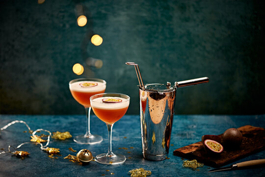Passionfruit Cocktails with Shaker on Festive Holiday Table