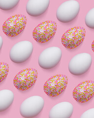 White and decorative easter eggs in colorful sequins as minimal trend repeated pattern pastel pink color. Pop art still life sparkling rhinestones eggs, spring easter holiday concept, modern design.