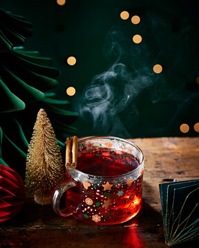 Hot Festive Christmas Drink with Cinnamon in Holiday Mug