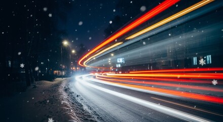 Long exposure of car lights on a snowy road at night with snowflakes falling in the city, winter scene