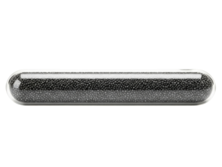 Transparent supplement capsule filled with small black granules on a transparent background