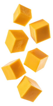 Orange cheese cubes falling isolated on a transparent background