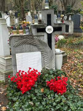 Stone cross on the tombstone in the public cemetery