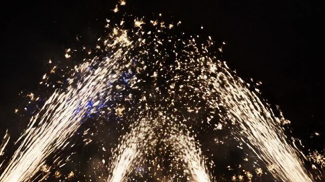 A golden fireworks display at night. Bright sparks and fountains exploding against a dark sky. Holiday celebration concept