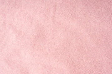 Soft pink cashmere sweater texture background.
