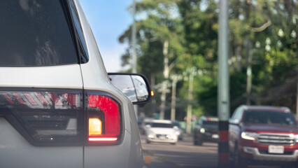 Rear side of grey car driving on the road. Enveronment traffic jam in the city with heavy...