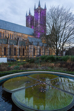 Lincoln Cathedral in Purple Light &mdash; Evening Scene with Gothic Towers, Wishing Fountain, and Winter Garden Framing