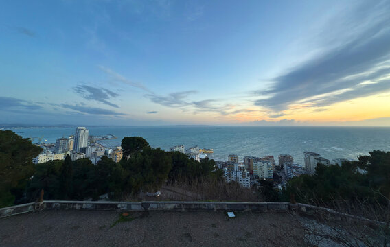 observation deck with view of Durres city, the second largest city in Albania, buildings streets evening light winter. Durres, Albania - Powered by Adobe