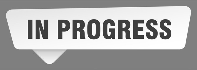 in progress sign. in progress white sticker isolated on gray background