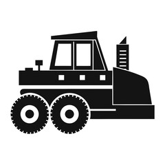 Silhouette of a heavy construction vehicle with large wheels