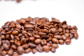 Roasted coffee beans on white background