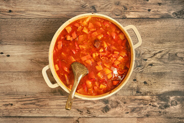 Savory beef stew simmering in a pot with vibrant vegetables and rich broth