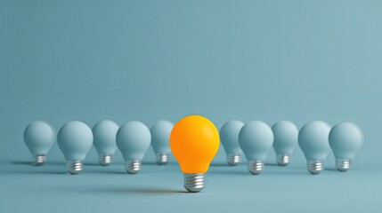 A vibrant yellow lightbulb stands out among a group of muted blue bulbs, symbolizing creativity and innovation against a soft turquoise backdrop.