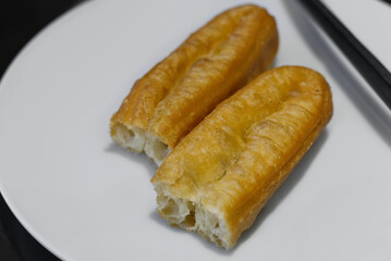 Chinese Youtiao (Chinese Fried Dough Sticks) on White Plate &ndash; Traditional Breakfast Snack in China