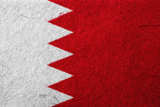 An abstract visual representation features bold red and white colors separated by a striking zigzag pattern, evoking a sense of national identity on a textured surface, embodying