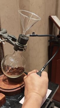 Laboratory coffee brewing apparatus with glass funnel coffee powder round flask barista hand cafe experiment manual extraction coffee science aroma evaluation laboratory glassware aroma test