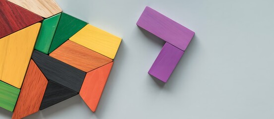 Colorful wooden tangram puzzle with separated part ready to connect