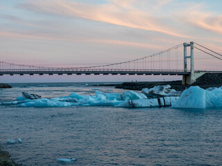 Bridge over Glacier Lagoon in Iceland at sunset