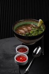 Pho bo soup in a beautiful plate for the menu isolated