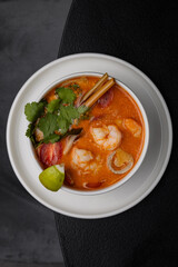 Tom yam soup in a white plate for menu isolated