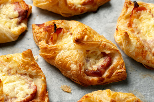 Cheese Bacon Turnovers pastry on baking paper
