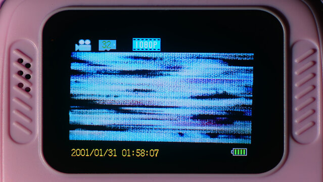 kids camera, children’s camera, camera screen, glitch screen, video glitch, digital glitch, pixel noise, corrupted video, glitch texture, screen distortion, blue glitch, malfunctioning screen.