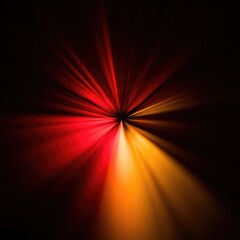 Abstract radial light burst in warm red, orange, and yellow tones on a dark background, creating a dynamic and energetic visual.