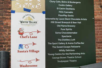 Fototapeta premium location marker and direction sign at Winter Village, The Distillery Historic District, Toronto