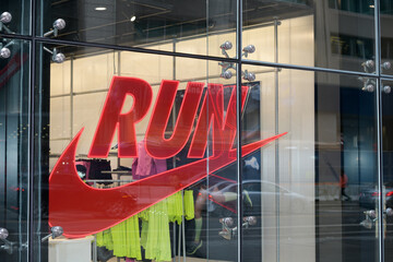 Fototapeta premium exterior building facade and sign of Nike Bloor, a sportswear store, located at 23 Bloor St E, Toronto