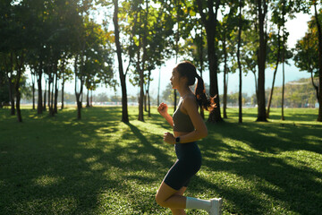 Young woman jogging outdoors seeing healthy lifestyle benefits