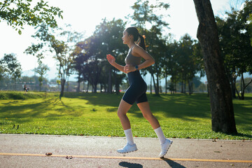 Woman jogging in park during morning workout