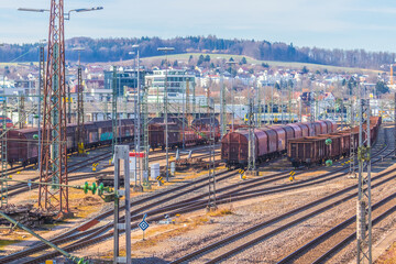 Part of the railway station of Ulm with some freight wagons on a sunny day