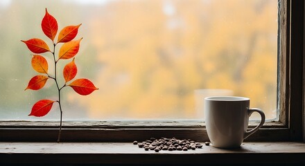 Coffee cup and autumn branch by a window with yellow foliage white