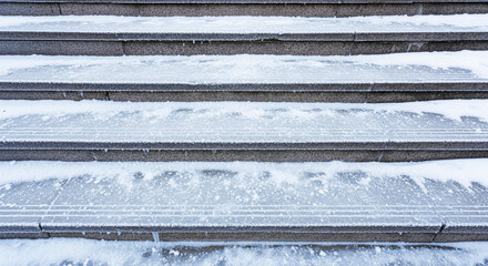 Icy outdoor stairs with salt for winter safety and slip prevention