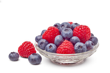 Colorful fresh berries in dish, Colorful and fresh berries displayed in clear bowl with natural highlights