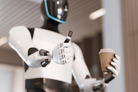 AI humanoid robot offers a coffee cup and gives a thumbs-up gesture in a modern office or cafe setting. Concept of excellent automated service and quality. Digital assistant robot on a coffee break - Powered by Adobe