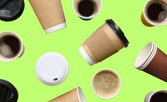 Blank white coffee cups and paper bags for food delivery isolated on a green screen background
