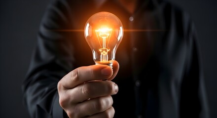 Get inspired with a bright idea person holding glowing light bulb symbol of creativity and innovation in business world