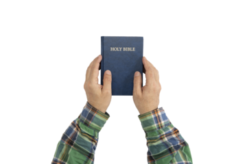 Hands holding Holy Bible book. Sacred scripture. Isolated background