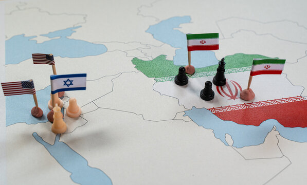 Political tensions escalating between Israel, Iran, and United States shown with chess pieces and flags on map Political tensions escalating between Israel, Iran, and United States shown with chess pieces and flags on map