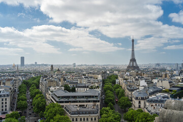 Scenic Paris skyline with the iconic Eiffel Tower under a cloudy sky