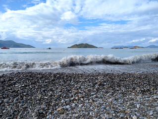Pebble Beach Waves Crashing by Scenic Islands