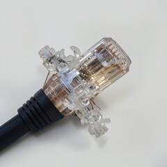Close-Up of Transparent Connector Plug on Light Background for Technology and Industry Applications