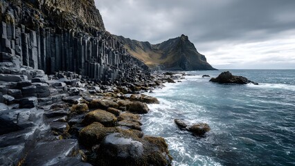 Volcanic basalt columns by the sea - hexagonal rock formations rising like organ pipes along a rugged coastline