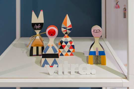 Colorful vitra wooden figures displayed on a shelf in a design store - Akureyri, Iceland - October 21 2025