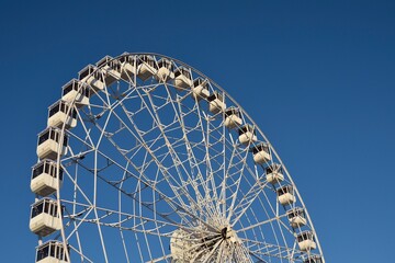 Ferris wheel. Observation. Ferris wheel with cabins for visitors. Attraction for viewing city from...