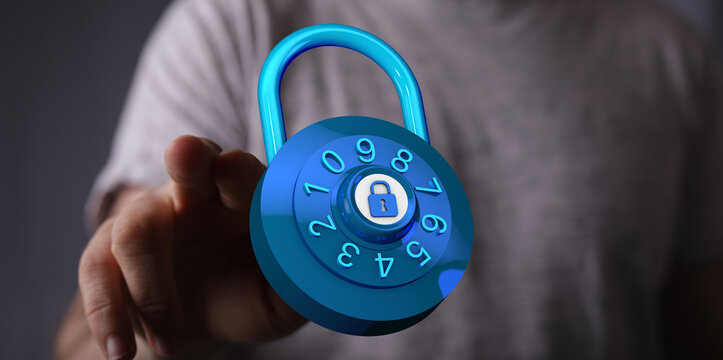 Hand reaching out to hold a digital security padlock to represent online safety, encryption, data protection an