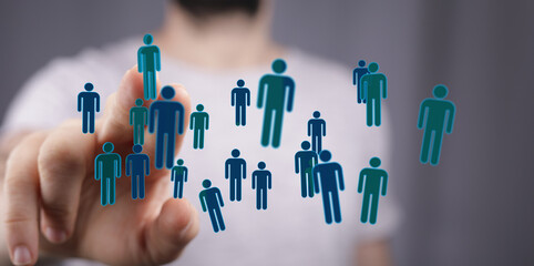 Hand pointing at floating silhouettes symbolizing people, representing connection and the digital age. Teamwork