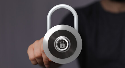Close up shot of a hand holding a digital padlock. Concept of cybersecurity, data protection, and privacy. Digi